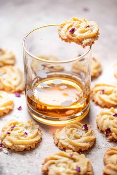 some cookies and a glass of alcohol on a table