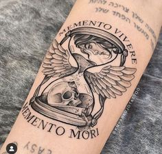 a tattoo with an hourglass and skull on the arm that says clemento vivere mementoo mor