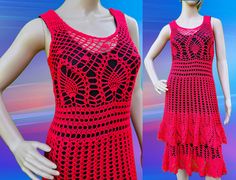 a red crocheted dress is displayed on a mannequin