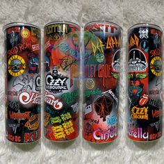 three different types of cans with graffiti on them