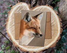 an image of a fox on a piece of paper in the shape of a heart