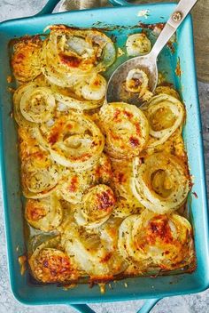 a casserole dish with onions and cheese on it, ready to be eaten