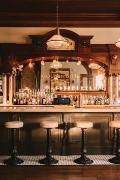 a bar with stools in front of it