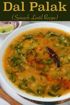 a bowl of dal palak with spinach and lentils