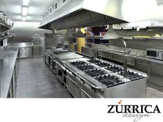 an industrial kitchen with stainless steel appliances and counters