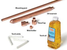 an assortment of tools including copper pipe, oil bottle and wrench