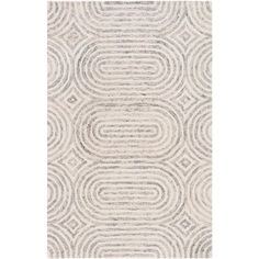 an area rug with circles in grey and white