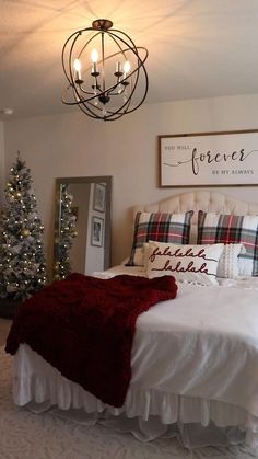 a bedroom decorated for christmas with lights on the ceiling