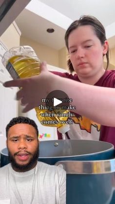 a woman pouring something into a glass next to a man in a white t - shirt