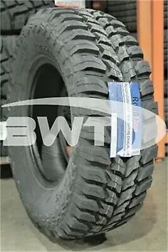 an image of a tire on display in a warehouse with the words, new tires