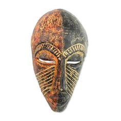 an african mask is shown against a white background