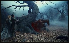 a man standing next to a horse in a forest under a moon filled sky with trees