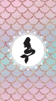 the silhouette of a mermaid sitting on top of a pink and blue background