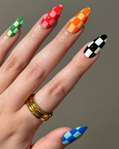 "Hand with vibrant checkerboard nail art featuring a mix of green, red, orange, black, and blue squares. A bold and playful manicure perfect for making a statement, trending in 2024." Nail Square, Orange Nail Art, Stylish Nail Art, So Make The Friendship Bracelets, Nail Polish Design, Shellac Colors, Orange Nail Designs, Make The Friendship Bracelets, Hard Gel Nails