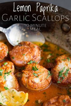 lemon paprika garlic scallops in a bowl with a spoon on the side