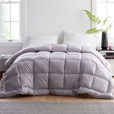 the comforter is made up and ready for someone to use it in their bed