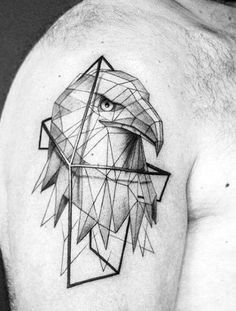 a man's shoulder with an eagle and geometric shapes on the side of his arm