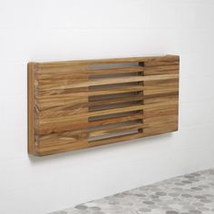 a wooden cutting board mounted to the side of a wall