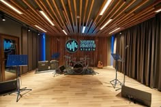 a recording studio with sound equipment and lighting