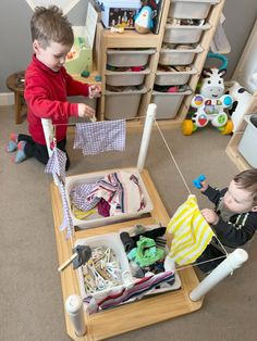 two children playing with toys in a room