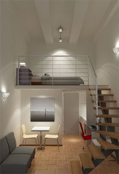 a living room filled with furniture next to a stair case in a loft style home