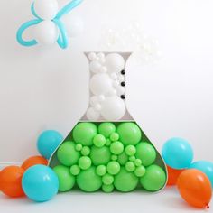 a science experiment is shown with balloons in the air