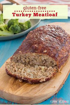 a sliced meatloaf on a cutting board with broccoli in the background