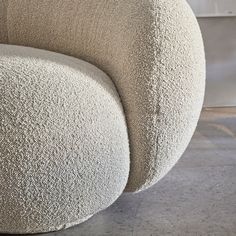 a white chair sitting on top of a cement floor