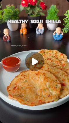 some food on a white plate with sauce and doll figurines in the background