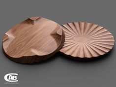 two wooden plates sitting on top of each other