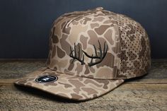 Drop tine Whitetail Rack Hat, Zapped Blackhawk Deer Antlers Cap, Deer Hunting Hat, White Tail Deer Cap Whitetail Deer Rack embroidered in Dark Brown onto a Zapped Blackhawk Brown Old School Camo Snapback Trucker Cap FEATURES: Water repellent Extremely Durable outer shell Slightly curved bill Medium profile (Great for average sized heads) One size fits most (58cm to 2nd snapback) Snapback Sweat absorbing ultra comfort sweatband Hunting Hats, White Tail Deer, Country Hats, Hunting Hat, White Tail, Whitetail Deer, Work Inspiration, Deer Antlers, Deer Hunting