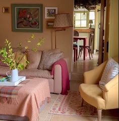 a living room filled with furniture and decor