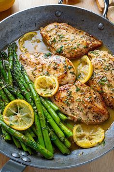 chicken, asparagus and lemons in a pan