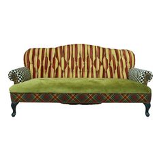 a green couch with checkered pillows on it's back and arms, against a white background