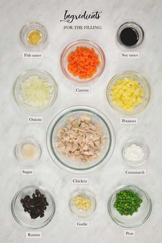 the ingredients needed to make this chicken salad are shown in bowls on a marble countertop