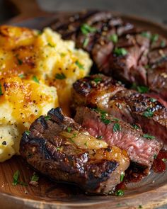 steak and potatoes on a wooden plate with parsley sprinkled garnish