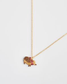 Wrap yourself in the cosy embrace of our Hedgehog Charm Necklace. This adorable necklace features a hand-painted enamel hedgehog snug in a tiny scarf. A symbol of resilience and exploration, this piece is perfect for those who cherish nature’s small wonders and the comforting beauty of autumn evenings.

Key Features:



Hand-Painted Hedgehog Charm: Adorned with a tiny scarf, this charm captures the cozy and resilient spirit of autumn.


Elegant Gold-Plated Brass Chain: The 18ct high polish gold Tiny Scarf, Swan Jewelry, Mushroom Jewelry, Talisman Necklace, Small Wonder, Gifts For Colleagues, Animal Brooch, Hair Slide, Pocket Mirror