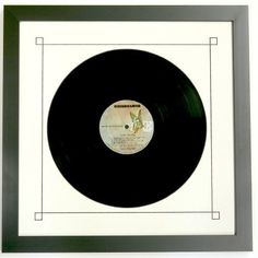 a black and white framed record in a frame