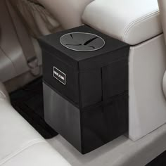 a black box sitting on the back seat of a car