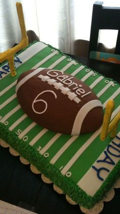 a football themed birthday cake on a table