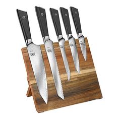 four knives on a wooden stand with black handles