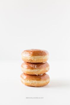 three glazed donuts stacked on top of each other