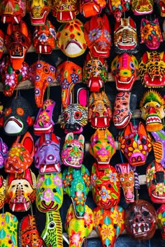 many colorful masks are on display for sale