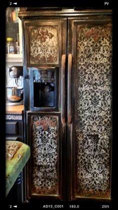 an old wooden armoire with ornate designs on it's doors and bottom panel