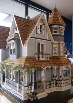 a doll house sitting on top of a table