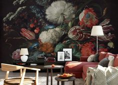 a living room with flowers painted on the wall