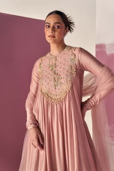 Editor's Note Elevate your style with our dusky pink fine silk long anarkali, featuring an embroidered yoke and a flowing silhouette. Paired with a net dupatta and organza ruffles, this ensemble exudes elegance and grace. Perfect for special occasions, it showcases the beauty of dusky pink and intricate embroidery. Fabric: Anarkali: fine silk, dupatta: net/organza Color: Dusky pink Components: Anarkali and dupatta Occasion: Festive Note: Product colour may slightly vary due to photographic light Pink Anarkali, Ridhi Mehra, Long Anarkali, Anarkali Dress Pattern, Indian Gowns Dresses, Desi Style, Embroidered Border, Kurta Designs Women, Dusky Pink