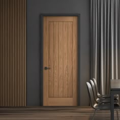 an empty chair sits in front of a wooden door with vertical slats on the wall