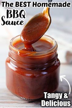 the best homemade bbq sauce in a glass jar with a spoon sticking out of it