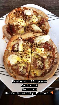 a white plate topped with pizza on top of a wooden table